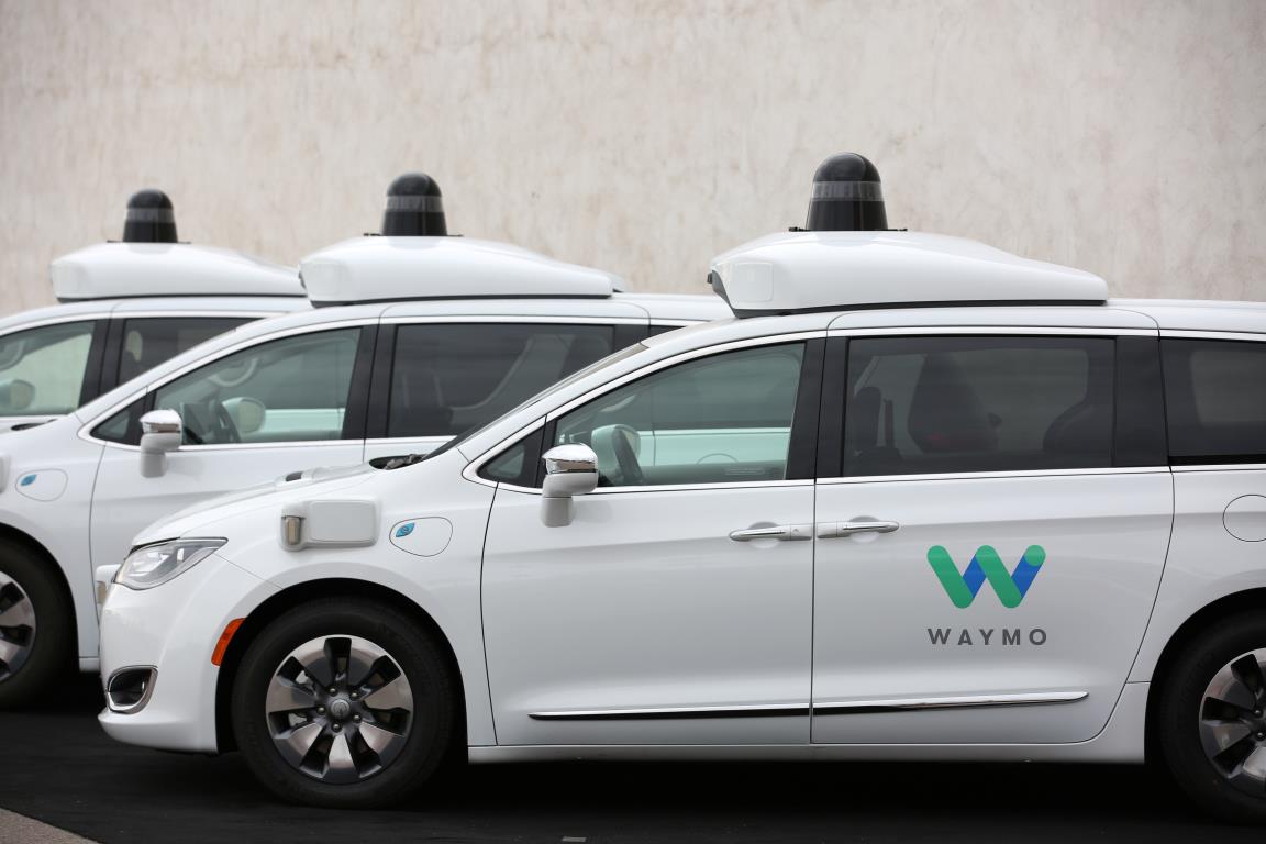 Three of the fleet of 600 Waymo Chrysler Pacifica Hybrid self-driving vehicles are parked and displayed during a demo<em></em>nstration in Chandler, Arizona, November 29, 2018.  REUTERS/Caitlin O’Hara