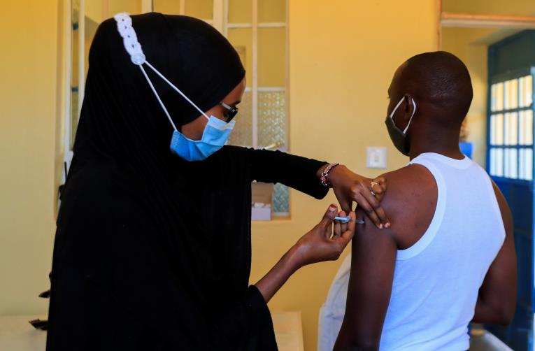 A nurse administers the coro<em></em>navirus disease (COVID-19) vaccine to a man at the Bissil Health Centre within Iibissil settlement, Matapato North of Kajiado county, Kenya August 23, 2021. REUTERS/Thomas Mukoya