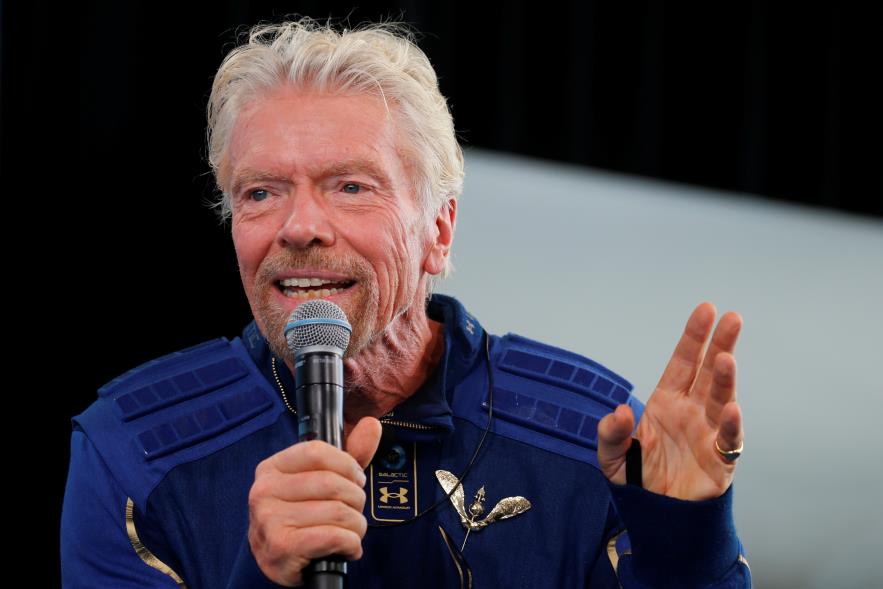 Billio<em></em>naire entrepreneur Richard Branson wears his astronaut's wings at a news conference, after flying with a crew in Virgin Galactic's passenger rocket plane VSS Unity to the edge of space at Spaceport America near Truth or Consequences, New Mexico, U.S., July 11, 2021. REUTERS/Joe Skipper/File Photo