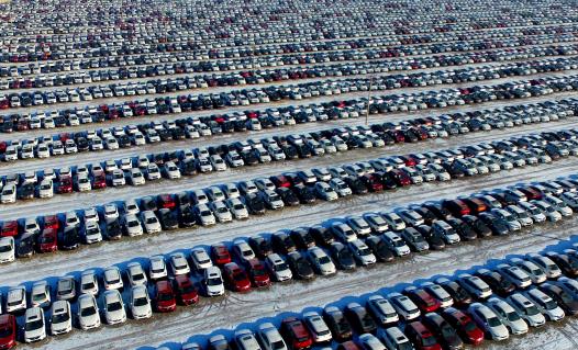 New cars are seen at a parking lot in Shenyang, Liao<em></em>ning province, China, January 16, 2017. REUTERS/Stringer/Files