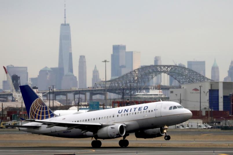 A United Airlines passenger jet takes off with New York City as a backdrop, at Newark Liberty Internatio<em></em>nal Airport, New Jersey, U.S. December 6, 2019. REUTERS/Chris Helgren