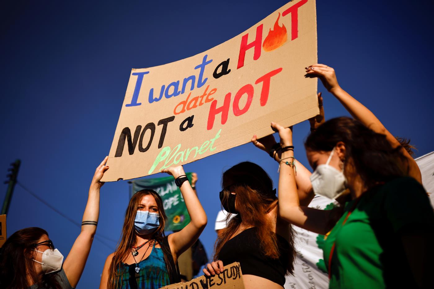 Greek students hold a placard during a Global Climate Strike rally of the movement Fridays for Future, in Athens, Greece, September 24, 2021. REUTERS/Alkis Konstantinidis