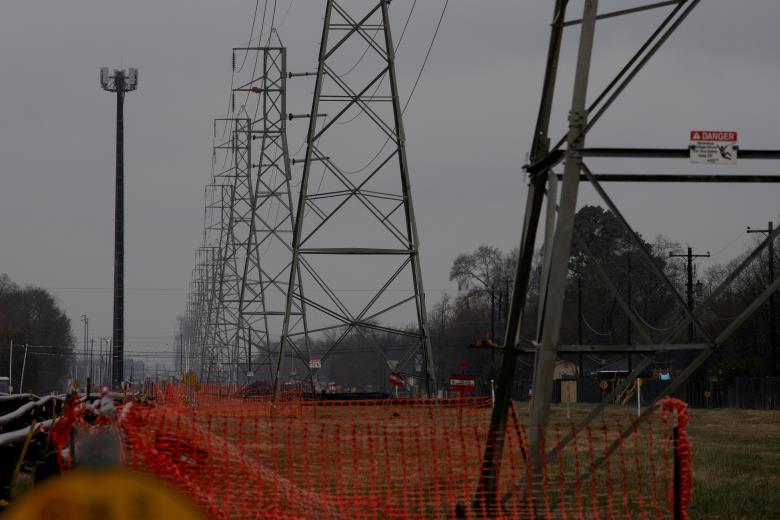 Overhead power lines are seen during record-breaking temperatures in Houston, Texas, U.S., February 17, 2021. REUTERS/Adrees Latif/File Photo