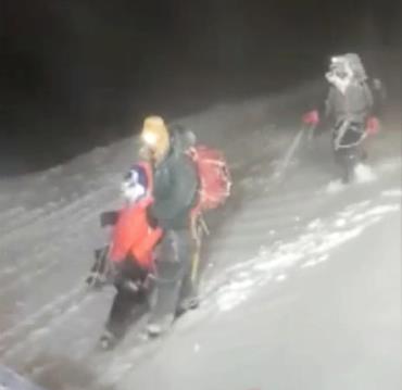 Members of Russia's Emergencies Ministry co<em></em>nduct a rescue operation after a group of climbers got stuck while climbing Mount Elbrus, in the Republic of Kabardino-Balkaria, Russia, in this still image from video taken September 23, 2021. Video taken September 23, 2021. Russia's Emergencies Ministry/Handout via REUTERS