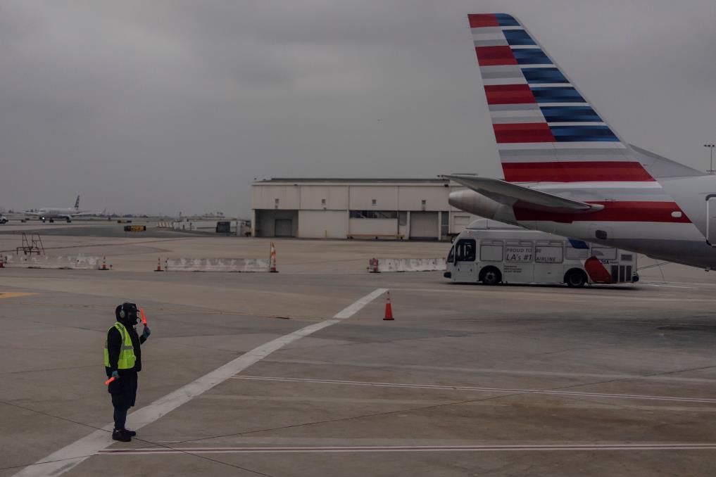 An American Airlines worker is seen at the Los Angeles internatio<em></em>nal airport as more than 1,400 American Airlines flights over the weekend have been canceled due to staff shortages and unfavorable weather in Los Angeles, California, U.S., October 31, 2021. REUTERS/Carlos Barria