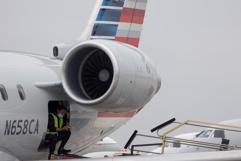 An American Airlines worker is seen at the Los Angeles internatio<em></em>nal airport as more than 1,400 American Airlines flights over the weekend have been canceled due to staff shortages and unfavorable weather in Los Angeles, California, U.S., October 31, 2021. REUTERS/Carlos Barria