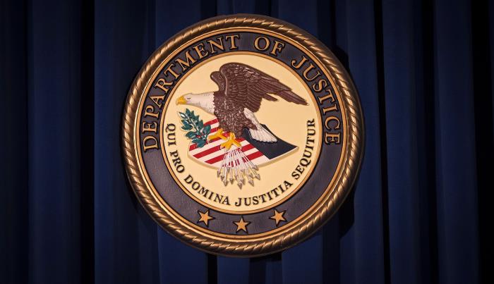 The Department of Justice (DOJ) logo is pictured on a wall after a news co<em></em>nference in New York December 5, 2013./File Photo