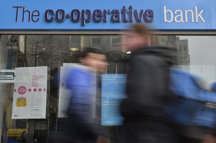 People walk past a branch of The Co-operative Bank in London, Britain, February 13, 2017. REUTERS/Hannah McKay