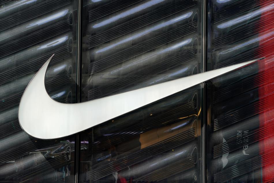 The Nike swoosh logo is seen outside the store on 5th Ave in New York, New York, U.S., March 19, 2019.   REUTERS/Carlo Allegri/File Photo