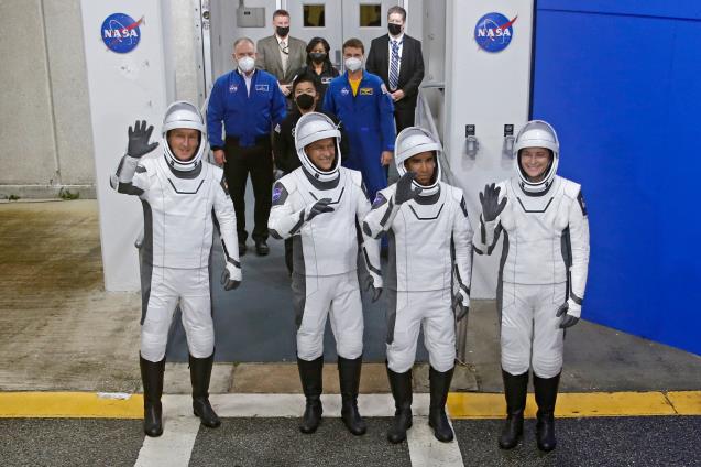 European Space Agency (ESA) astro<em></em>naut Matthias Maurer of Germany, NASA astro<em></em>nauts Raja Chari, Tom Marshburn, and Kayla Barron wave while departing the crew quarters for launch aboard a SpaceX Falcon 9 rocket on a mission to the Internatio<em></em>nal Space Station at the Kennedy Space Center in Cape Canaveral, Florida, U.S., November 10, 2021. REUTERS/Joe Skipper