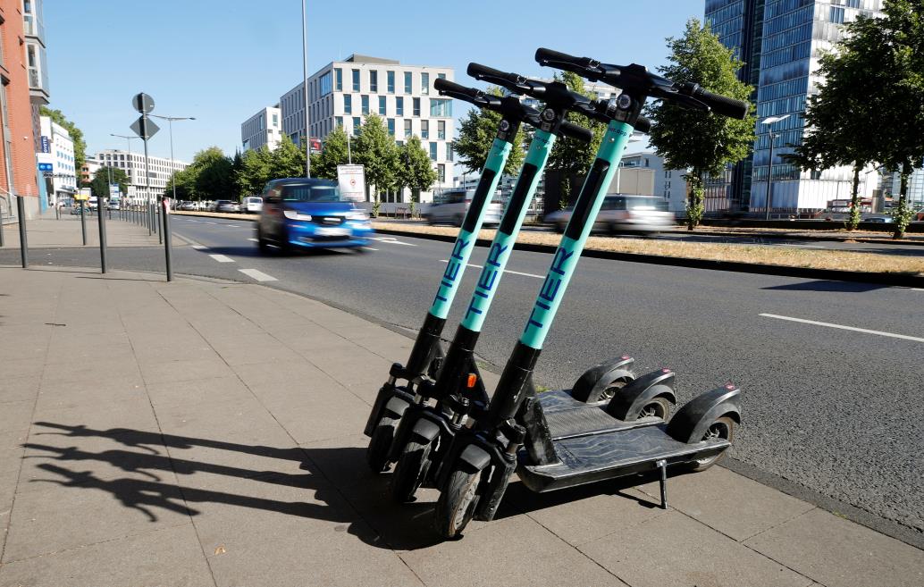 E-scooters of Tier Mobility, a start-up for shared micro-mobility services, are parked in Cologne, Germany, July 23, 2019. REUTERS/Wolfgang Rattay/File Photo