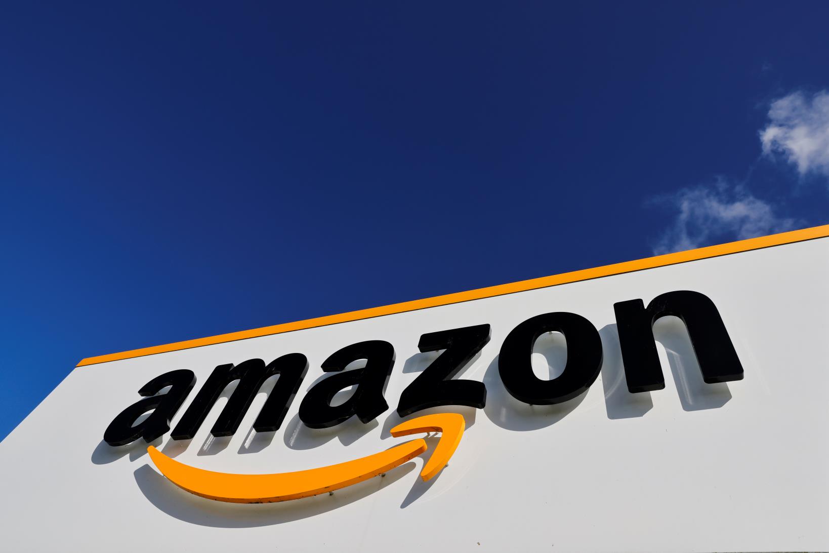 The logo of Amazon is seen at the company logistics centre in Boves, France, October 6, 2021 REUTERS/Pascal Rossignol