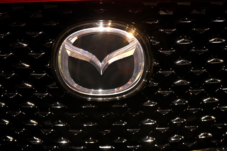 The logo of Mazda is pictured at the LA Auto Show in Los Angeles, California, U.S., November 20, 2019. REUTERS/Andrew Cullen/File Photo