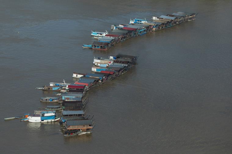 An aerial view shows dredging rafts operated by illegal miners who have gathered in a gold rush on the Madeira, a major tributary of the Amazon river, in Autazes, Amazo<em></em>nas state, Brazil November 23, 2021. REUTERS/Bruno Kelly