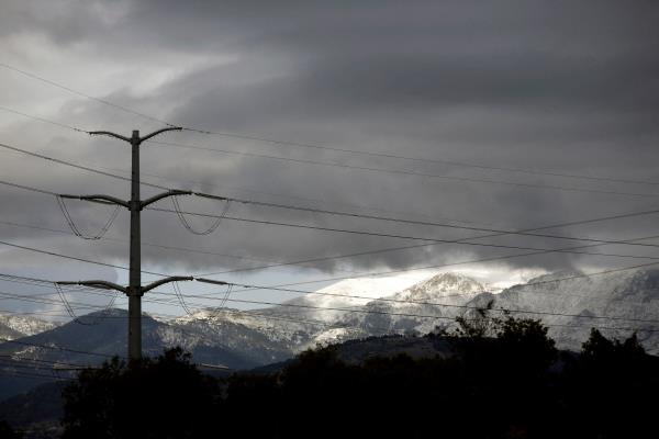 An electricity pylon of high-tension electricity power lines is seen in Galapagar