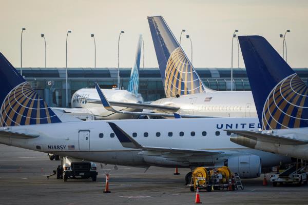 United Airlines planes are parked at their gates at O'Hare Internatio<em></em>nal Airport ahead of the Thanksgiving holiday in Chicago, Illinois