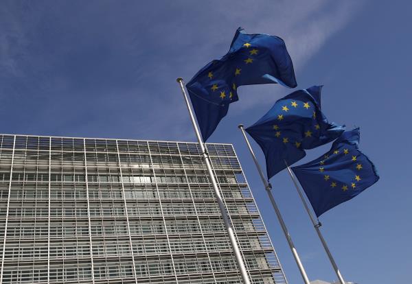 European Unio<em></em>n flags flutter outside the European Commission headquarters in Brussels