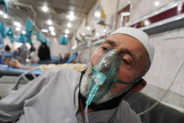 A man uses an oxygen mask at a hospital during a sandstorm in Baghdad