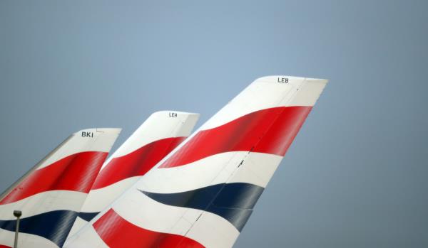 British Airways logos are seen on tail fins at Heathrow Airport in west London