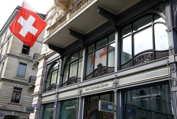 Switzerland's natio<em></em>nal flag flies at the headquarters of Swiss bank Bank Sparhafen Zuerich in Zurich