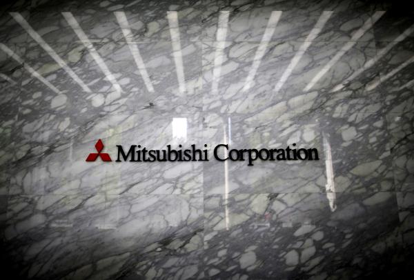 The logo of Mitsubishi Corporation is displayed at the entrance of the company headquarters building in Tokyo