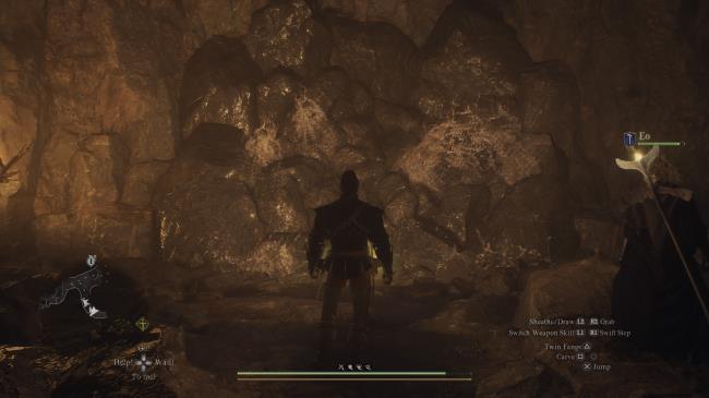 Player Arisen standing in front of a breakable rock wall in Drabnir's Grotto in Dragon's Dogma 2.