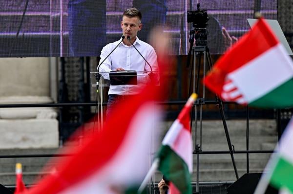 Peter Magyar, a lawyer and businessman formerly close to Hungary's ruling natio<em></em>nalist government, stands on stage during an anti-government protest led by him, in Budapest April 6, 2024. — Reuters pic  