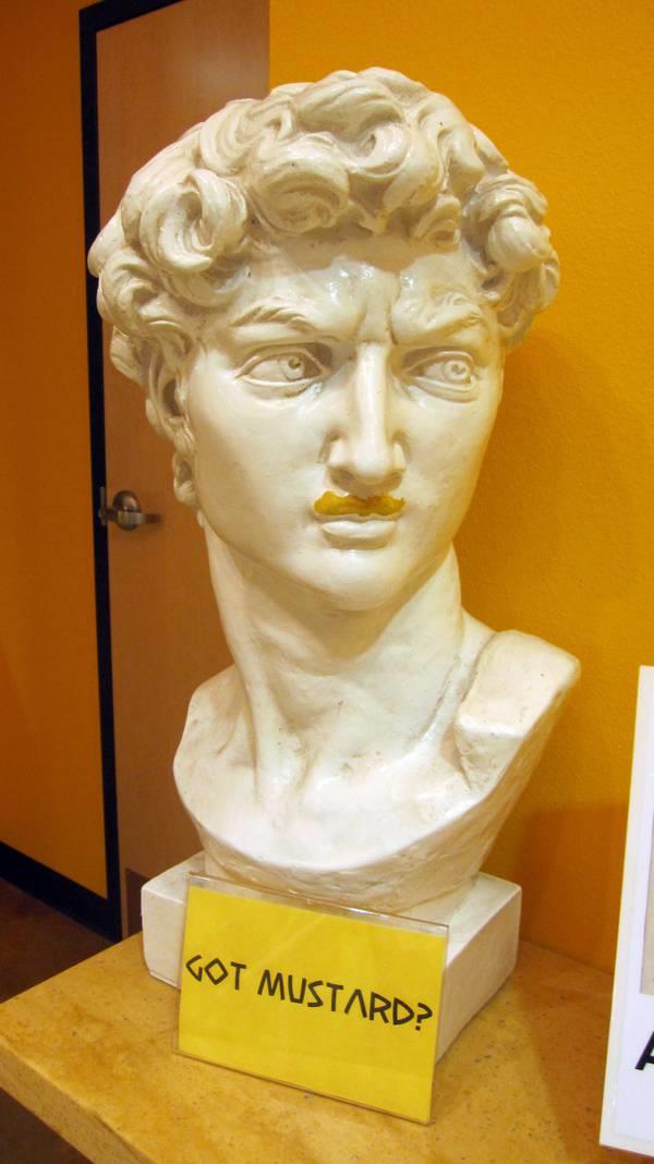 A bust of Michelangelo’s David gets a mustard mustache at the Natio<em></em>nal Mustard Museum.