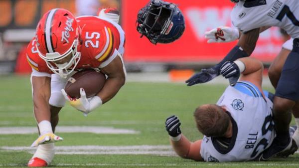 Maryland Terrapins running back Nolan Ray falls to the 32 yard line along with the helmet of Villanova Wildcats linebacker Brendan Bell during a non-co<em></em>nference game in College Park. (Karl Merton Ferron/Staff)