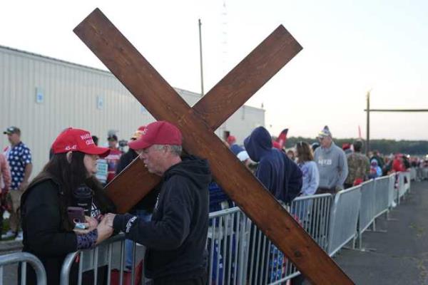 Dan&#x20;Beasley&#x20;of&#x20;Northville,&#x20;Mich.,&#x20;prays&#x20;with&#x20;Sue&#x20;Hensal&#x20;of&#x20;Akron,&#x20;Ohio,&#x20;before&#x20;Republican&#x20;presidential&#x20;nominee&#x20;former&#x20;President&#x20;Donald&#x20;Trump&#x20;speaks&#x20;at&#x20;a&#x20;campaign&#x20;rally&#x20;at&#x20;the&#x20;Butler&#x20;Farm&#x20;Show,&#x20;the&#x20;site&#x20;wher<em></em>e&#x20;a&#x20;gunman&#x20;tried&#x20;to&#x20;assassinate&#x20;him&#x20;in&#x20;July,&#x20;Saturday,&#x20;Oct.&#x20;5,&#x20;2024,&#x20;in&#x20;Butler,&#x20;Pa.&#x20;&#x28;AP&#x20;Photo&#x2F;Alex&#x20;Brandon&#x29;