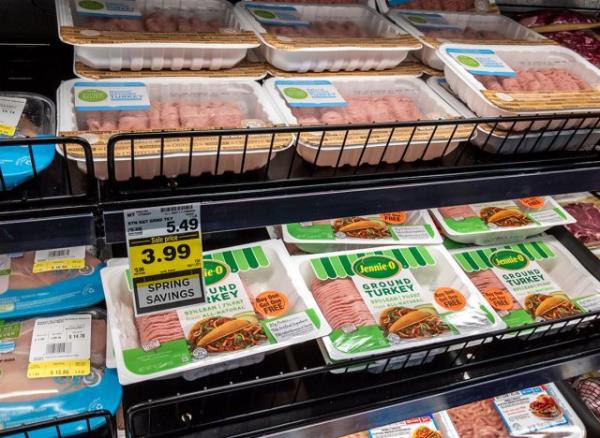 View of packaged ground turkey meat at QFC grocery during a buy one get one free sale.