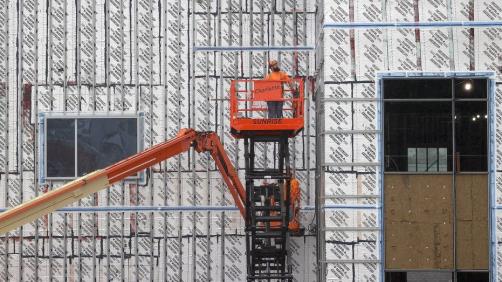 Co<em></em>nstruction worker in a lift