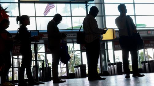 People wait in job fair line