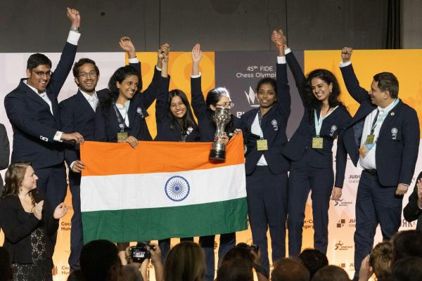 Membes of the Indian chess team celebrate together after the women's team was awarded the gold medal in the 2024 Chess Olympiad in Budapest, Hungary, September 22.