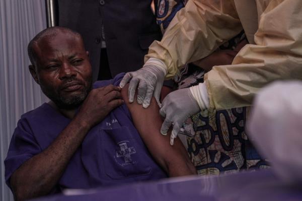 A clinician administers the mpox vaccine to a hospital staff member during the launch of the vaccination campaign at the General Hospital of Goma October 5, 2024. — AFP pic