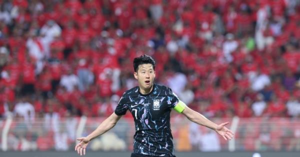 Son Heung-min of Korea celebrates after scoring against Oman during the teams' Group B match in the third round of the Asian World Cup qualification at Sultan Qaboos Sports Complex in Muscat on Sept. 10. (Yonhap)