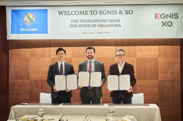 From left: Egnis CEO Park Chan-ho, Oklahoma Department of Commerce Executive Director Evan Brown and Xolution CEO Marc Von Rettberg, pose during a business signing ceremony held at The Shilla Seoul, on Tuesday. (Egnis)