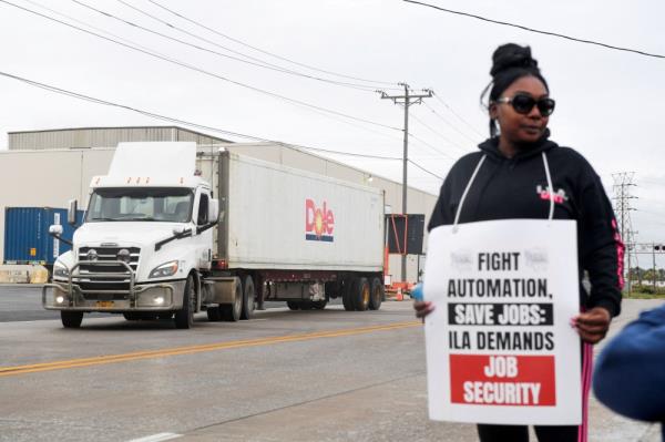 A dockworker demo<em></em>nstrates after a shipping port strike went into effect across the East Coast at the Port of Wilmington, Delaware October 1, 2024. — Reuters pic  