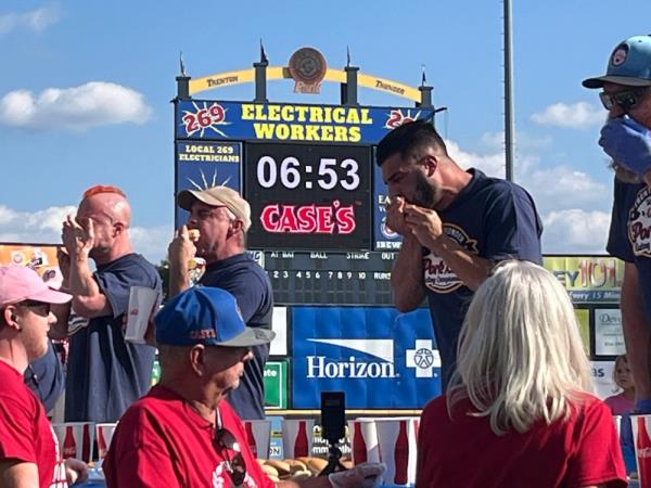 Competitors take part in a pork roll competitive eating co<em></em>ntest in Trenton, New Jersey, on September 21, 2024. — AFP pic