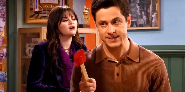 Justin Russo is holding a red spatula while Alex talks to her brother in Wizards Beyond the Waverly Place