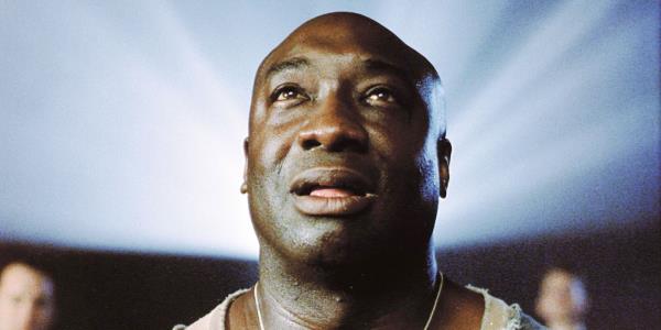 Michael Clarke Duncan as John Coffey fascinated in a movie theater in The Green Mile