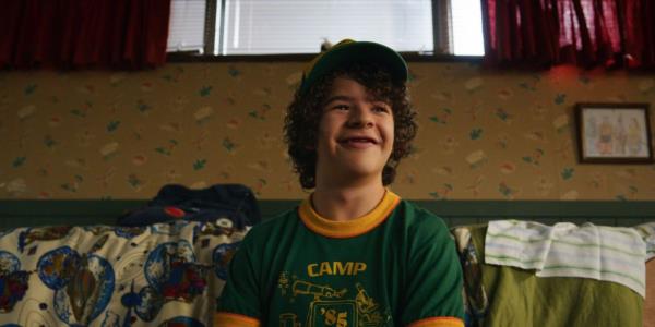 Gaten Matarazzo as Dustin Henderson smiling in Season 3 of Stranger Things