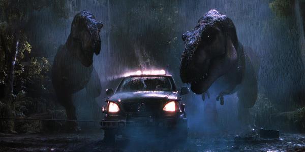 Two T-Rexes are attacking a car in The Lost World Jurassic Park