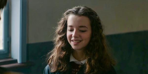 Sara (Ariella Glaser) smiling in White Bird