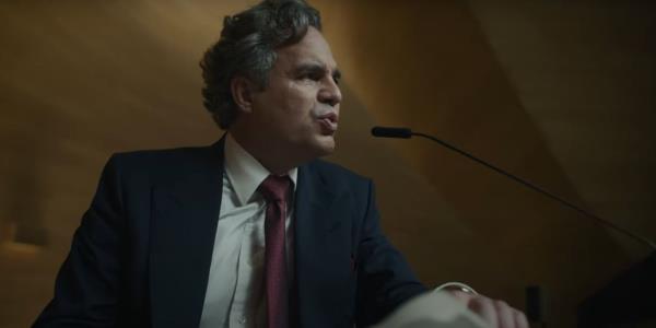 Mark Ruffalo speaking at a podium in Mickey 17