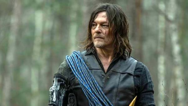 Daryl standing in the forest looking off to the side on The Walking Dead: Daryl Dixon