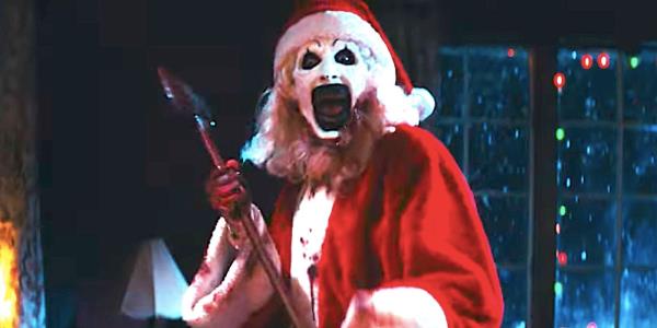 Art the Clown dressed as Santa Claus holding an axe in Terrifier 3's trailer-1