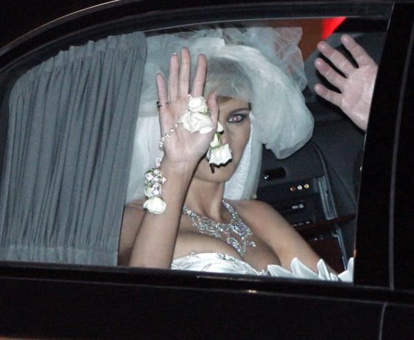 Melania Trump waving in bridal dress