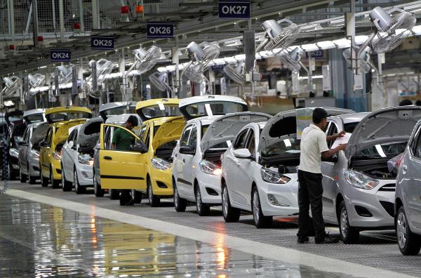 Workers assemble cars inside the Hyundai Motor India Ltd. plant at Kancheepuram district in Tamil Nadu.