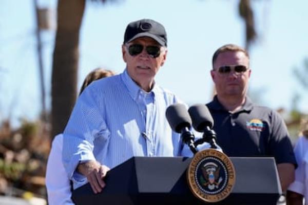 U.S. President Joe Biden speaks as he visits storm-damaged areas in the wake of Hurricanes Milton and Helene, in St. Pete Beach, Florida.